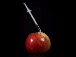HD SUPER SLOW-MO: Stabbing An Apple With A Syringe Stock Footage