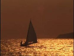 Distant Sunset Sloop Stock Footage