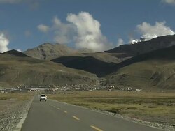 Tilt Down Road to Darchen and mountains Lhasa Tibet China Stock Footage