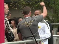 Lewis Hamilton is the first torch relay runner as Stock Footage