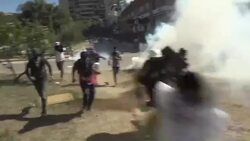 CLEAN : Venezuelan demonstrators clash with police News Clip