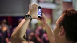 Man records Brazilian street performance with smartphone Stock Footage