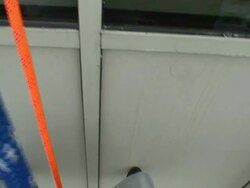 POV hand-held - A window washer rappels down a high-rise office building on a blue rope. / Wisconsin, USA Stock Footage