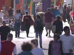 People walking along Bournemouth promenade News Clip