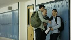 Young adult males bullying another student Stock Footage