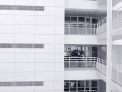 White office building with elevated walkway, crane-down camera movement Stock Footage