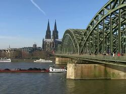 MS Shot of Rhine river with Hohenzollern Bridge and Dom (Cathedral) / Cologne, North Rhine Westphalia, Germany Stock Footage