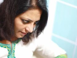 Cheerful Indian Woman Using Laptop at Home Stock Footage
