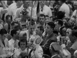 1948: DEMOCRATIC NATIONAL CONVENTION: DIXIECRATS WALK-OUT: Male Delegate from Alabama standing w/ others on crowded floor saying they (delegates) will proceed to walk out & return to Alabama & report to the party they represent... States Rights Instructional Video