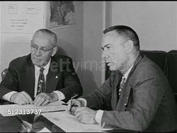 1951: EMERGENCY PREPAREDNESS: DRAMATIZATION: Leader of city official meeting asking 'Colonel' to attend Communications meeting, asking about radio stations. Civil Defense Plan, The Red Scare, McCarthyism. Instructional Video