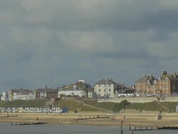 Southwold,colourful beach huts,People walking on promenade,,Lighthouse,WS,ZO Stock Footage