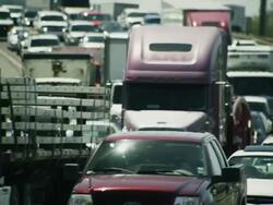 Long lens, huge traffic congestion on interstate highway. Stock Footage
