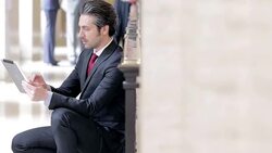 Lawyer using tablet computer in courthouse hallway Stock Footage