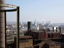 WS View of industrial chimneys in distance from World Cultural Heritage Site Volklingen Ironworks (Volklinger Hutte) / Volklingen, Saarland, Germany Stock Footage