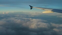 Airplane Wing in Front of Clouds Stock Footage