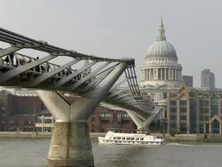 MS One ferry boat flowing under millenium bridge / London, England, Great Britain  Stock Footage
