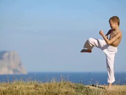 boy kicking coaches on the coast Stock Footage