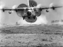 Air Force Transport Plane Drops Cargo Stock Footage
