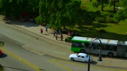old havana cuba vintage jaguar passing mural and statue Stock Footage