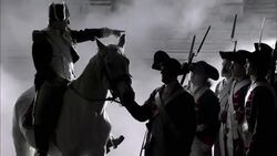 A military leader on a white horse gives orders to soldiers in French Revolution uniforms. Stock Footage