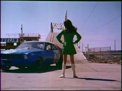Sexy woman in go-go boots gets in her AMC Javelin Stock Footage