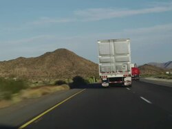 MS TS View of freeway forty highway with crossing trucks on road / Freeway No. 40, Arizona, USA Stock Footage