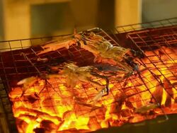 panning : cooked craps under low light Stock Footage