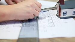 Architect working on blueprint Stock Footage