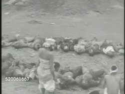 1950: KOREAN WAR: SEOUL: * SEMI-GRAPHIC WS PAN (R) Rows of deceased South Koreans lying on in line on dirt road, other Koreans cleaning, counting bodies, people observing bodies. Casualties, KIA, killed in action, war torn, Korea Instructional Video