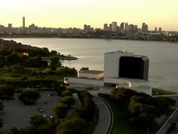 AERIAL, John F. Kennedy Presidential Library and Museum and downtown district skyline across harbor, Boston, Massachusetts, USA Stock Footage
