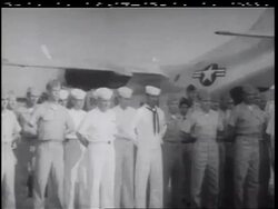 B/W 1960s soldiers + sailors standing at ease by military airplane / Vietnam War / documentary Stock Footage