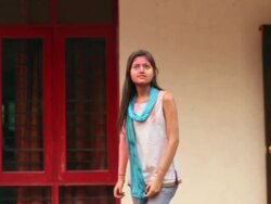 Water falling on a young woman in holi festival  Stock Footage