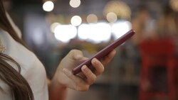 Using smartphone in a Cafe Stock Footage