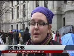 Nearly 50 members of Occupy Philadelphia sat with arms linked as a deadline to leave the site of their protest set by the city passed without any immediate action News Clip