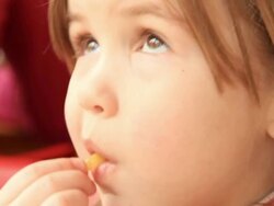 Little girl eating French fries at the fastfood Stock Footage