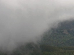 AERIAL WS POV View of clouds and mountain and grass field / Montana, United States Stock Footage