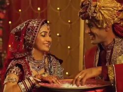 Bride and groom searching ring into a container   Stock Footage