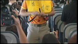 Flight attendants of budget airline perform in-flight safety demo as a dance Instructional Video