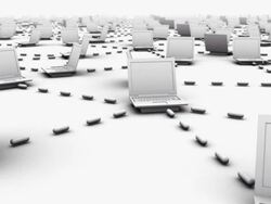 High-angle camera tracks screen-right across innumerous connected laptops Stock Footage