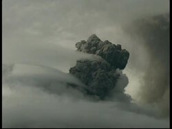 WA grey smoke and ash cloud rising quickly upwards from crater, zoom out then zooms in to CU, Mount Tunguragua, Ecuador Stock Footage