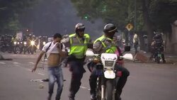 CLEAN : Caracas police fire tear gas and water cannon at students News Clip