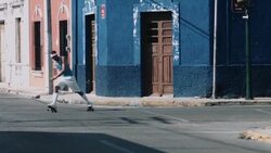 Young adult male rollerblade in urban street Stock Footage