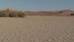 Dry, cracked mud stretches across the Namib Desert, South Africa. Stock Footage