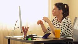 Beautiful young woman looking at the computer monitor. Stock Footage