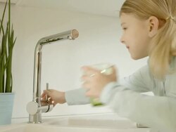 Little Girl Pouring Tap Water Stock Footage