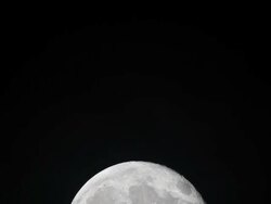 Large Full Moon Partially Rising with Slight Movement Right Stock Footage