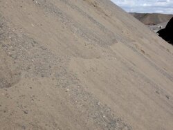MS Young businessman dressed in  black suit sitting on  sand dune in  rural area / Maple Grove, Minnesota, United States Stock Footage
