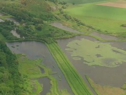 MS AERIAL ZO Shot of farm field and houses at Monte Kali / Germany Stock Footage