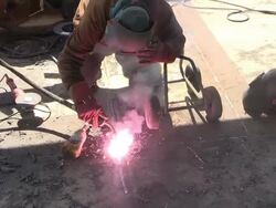 MS Shot of welder at bridge construction / Wellen, river Moselle, Germany Stock Footage