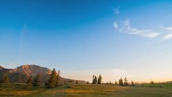 Time-Lapse shooting from the prairies to the sunrise on a mountain face Stock Footage